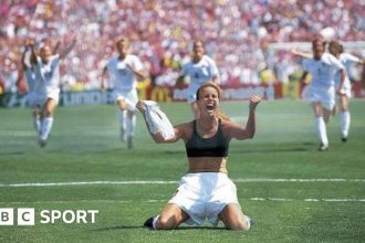 Brandi Chastain celebrates after scoring the winning penalty kick against China