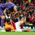 Tottenham keeper Fraser Forster checks on Mauro Icardi as the Galatasaray striker lies injured on the ground