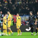 Kosovo and Romania players arguing