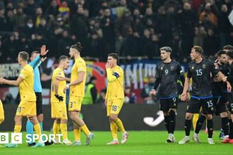 Kosovo and Romania players arguing