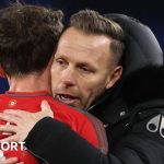 Craig Bellamy embraces Joe Allen as Wales celebrate beating Iceland