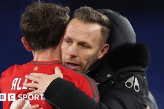 Craig Bellamy embraces Joe Allen as Wales celebrate beating Iceland