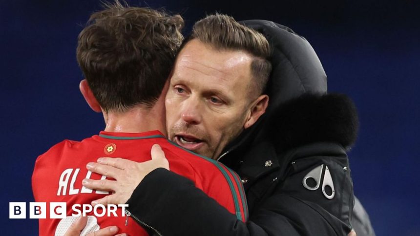 Craig Bellamy embraces Joe Allen as Wales celebrate beating Iceland